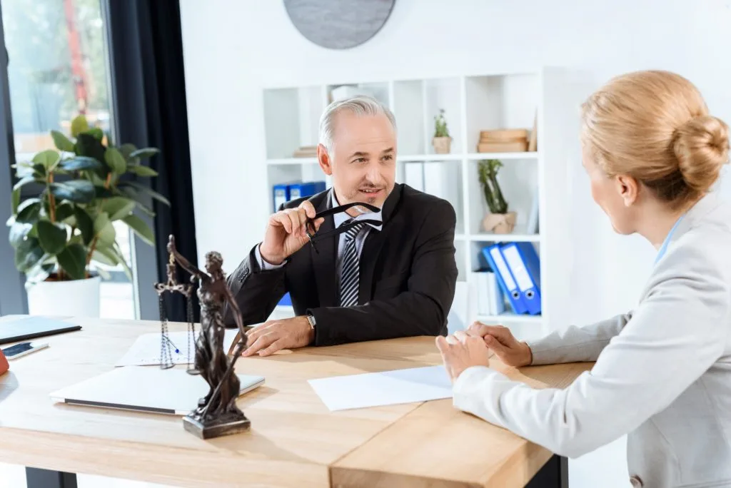 Mature Lawyers Discussing Documents In Office 1024X684 1 | RODRIGUEZ GARCIA ALBERTO JOSE